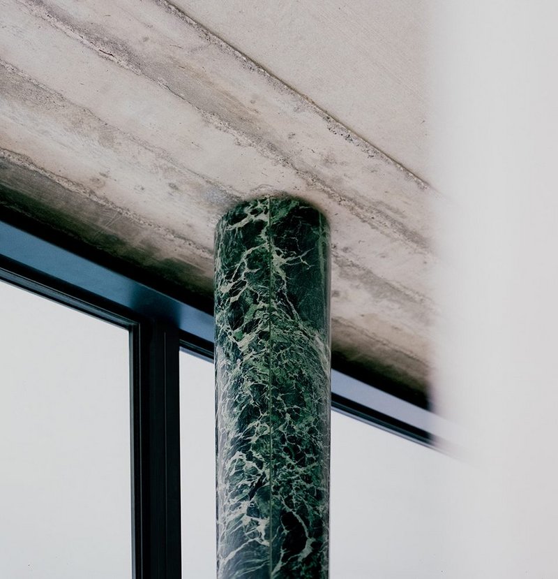 Marble off-cuts clad a steel column.