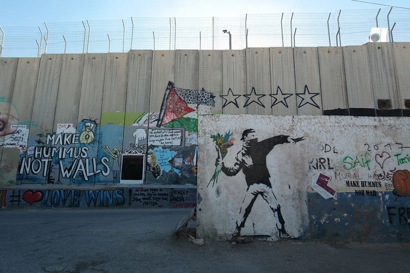 A plethora of other political cartoons and slogans have joined Banksy's trademark stencils.