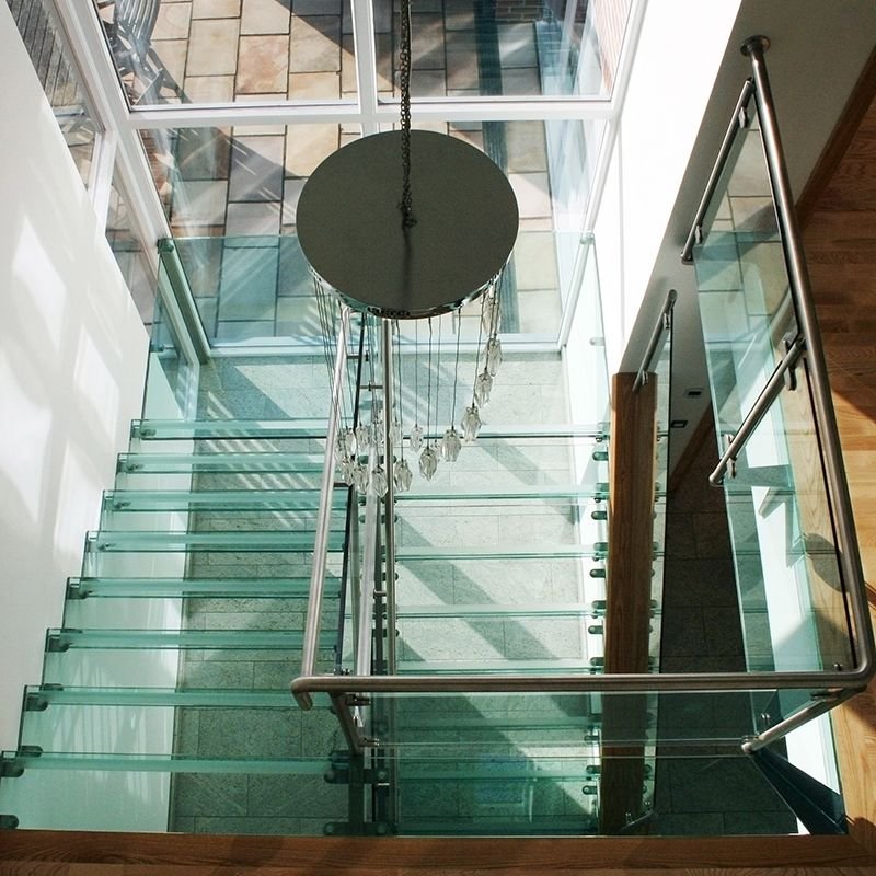 A Canal Engineering stair with glass treads and glass balustrades
