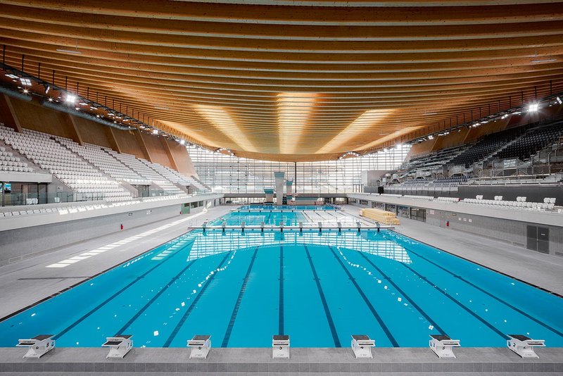 The 71m-long swimming pool can be reconfigured using movable walls to enable it to host multiple events during the Olympic Games and subsequently for legacy use.