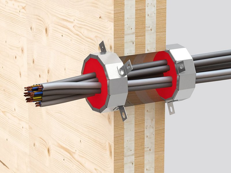 Cable penetrations through CLT are firestopped with Hilti's tested and approved CF CC cable collar, a dry fit solution.