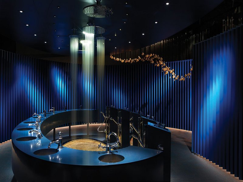 Terminating the showroom is a darkened egg-shaped space where visitors experience a showering light show.