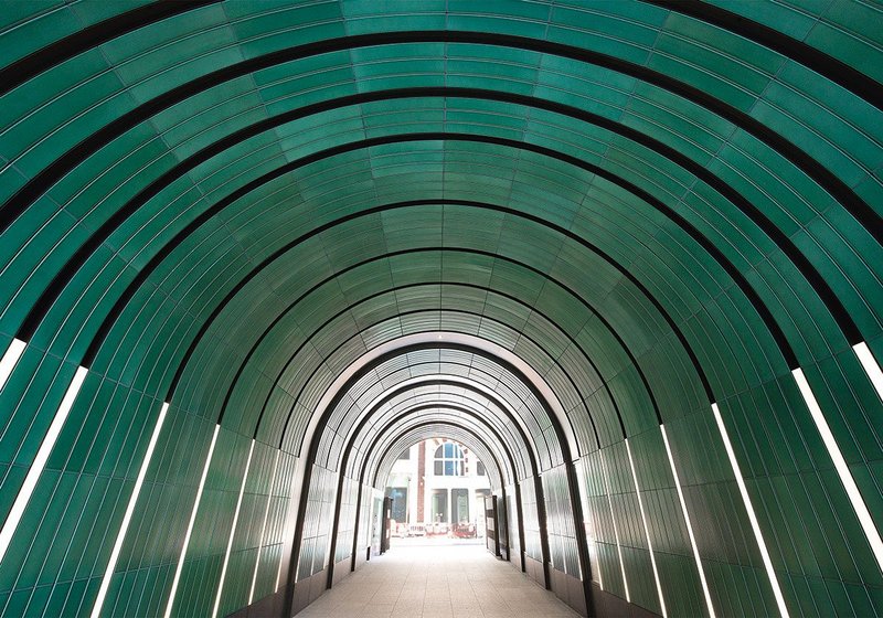 Jade green rainscreen panels wrap across the arch for the entire length of the Rathbone and Newman Passages in a rhythmic design enveloping those passing through the tunnels.