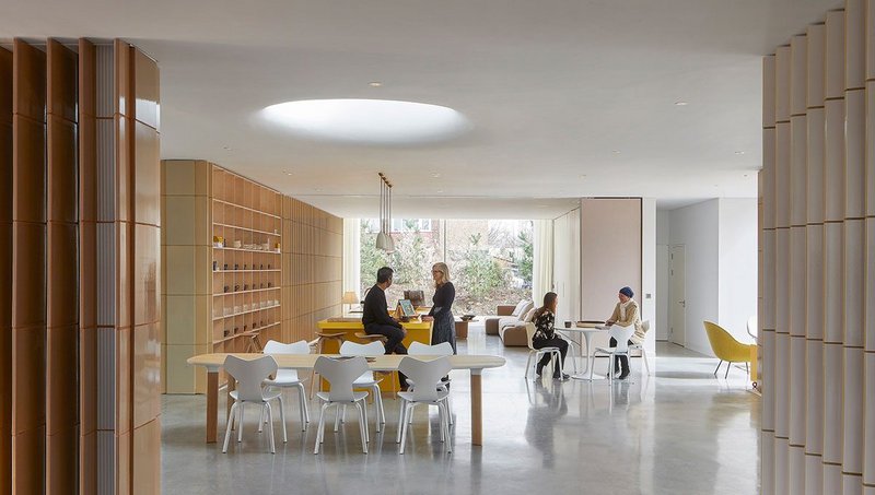 An oculus above the central dining table is at the heart of the open-plan interior.