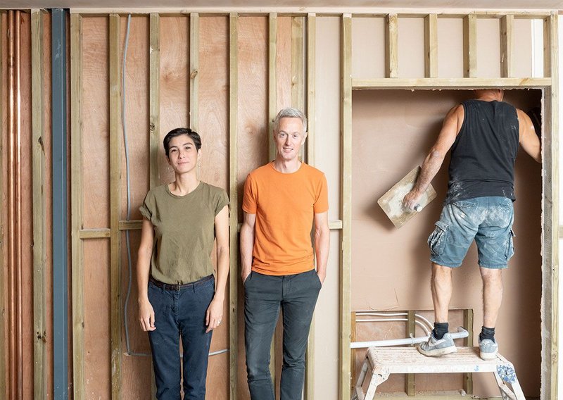 Hana Loftus (left) and Tom Grieve with plasterer downstairs at Trinity Works in Colchester. This is going to be the kitchen of Café Saison.