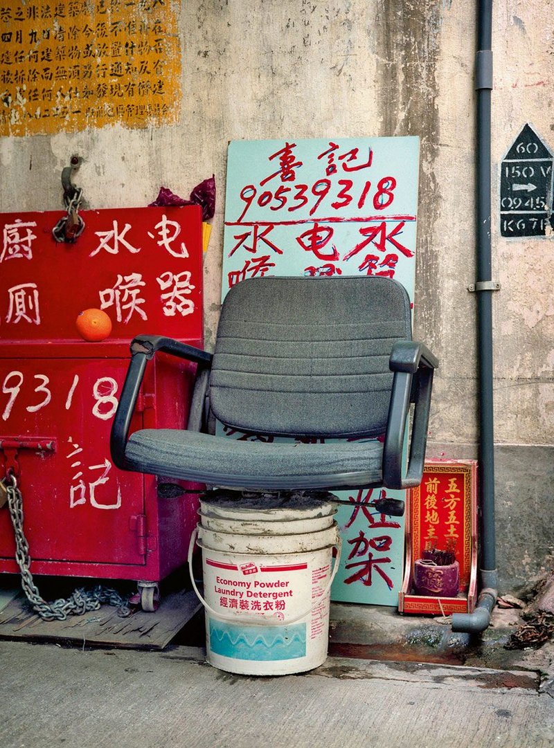 Photograph from Michael Wolf’s series Bastard Chairs, 1995–2017, a study of ad hoc urban ingenuity.