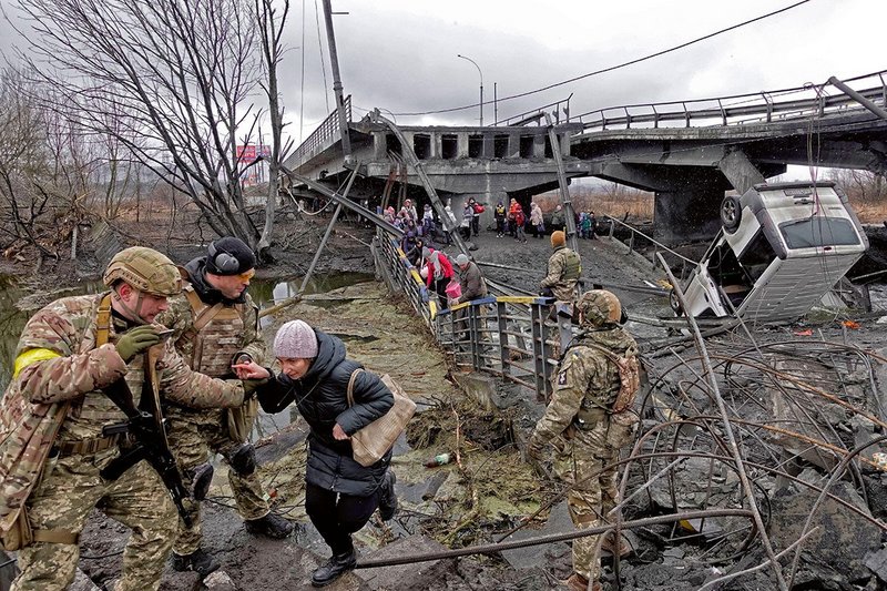 Irpin, Ukraine on  3 March by a bridge shelled by the Ukrainians to slow down Russian convoys