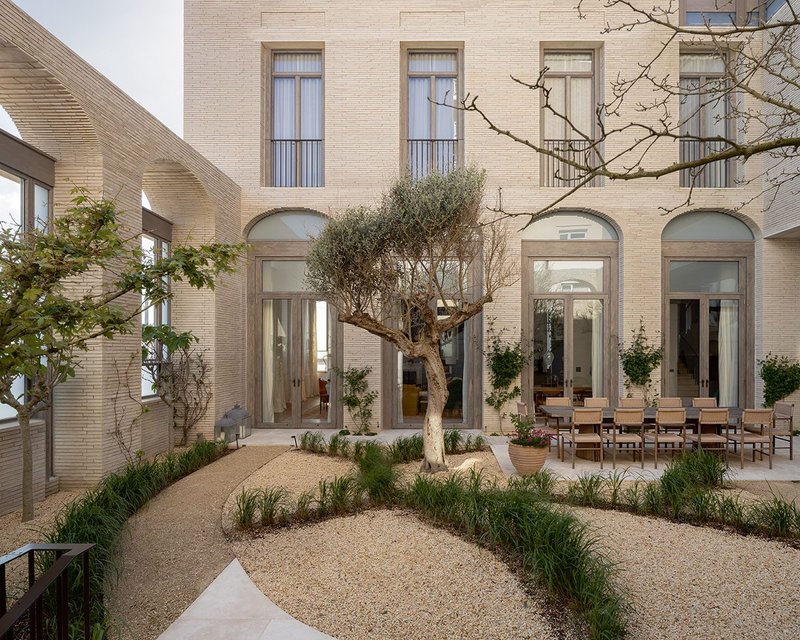 Courtyard garden looking back to the living room’s tall French doors.