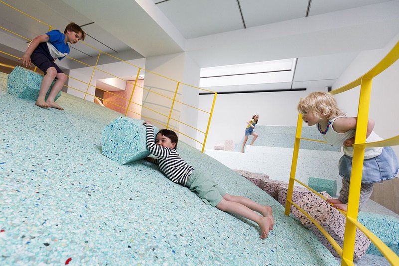 Children taking on the RIBA's foam version of the brutalist playground.