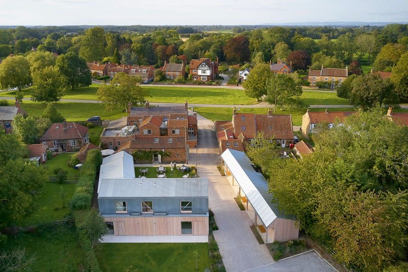 The Alice Hawthorn looking north to the medieval Green. Its new bedroom blocks revert to type- agricultural buildings set behind the houses fronting the village.