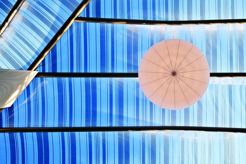 One of the outsize lights that add a luxury to the giant space of the atrium.