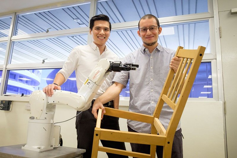 Engineers at Nanyang Technological University in Singapore with their smart industrial robots.