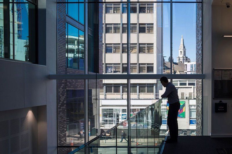 Refurbished Merrion House (left) and new annexe (right) are linked by an atrium. Merrion House, Leeds, BDP, RIBA Regional Award 2019.