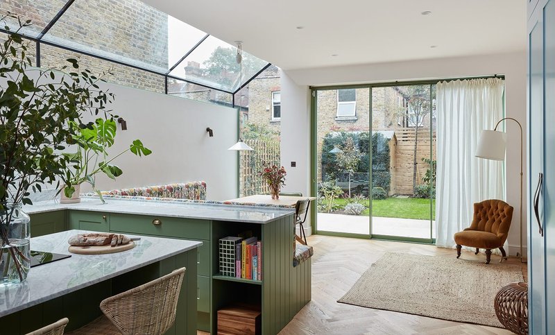 Maxlight sliding doors and up-and-over rooflight at Brockwell Garden in London by architect Studio Elephant and interior designer Lizzie Green.