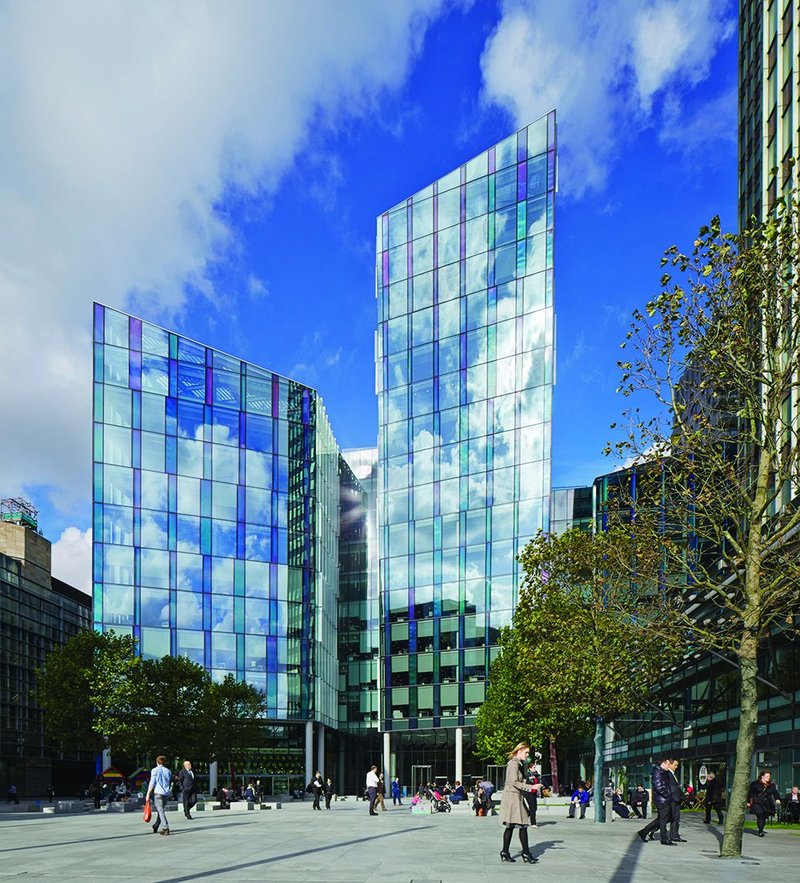 The south facade looking onto Regents Place plaza, part of a managed public space containing works by artists Gary Hume and Julian Opie, and a small steel pavilion by architect Carmody Groarke.