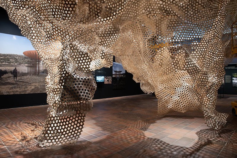Installation view of a woven sculpture depicting the Shimoni Cave at The Architect’s Studio: Cave_bureau at the Louisiana Muesum of Modern Art.