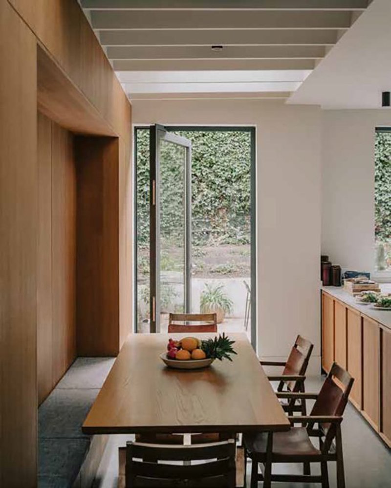 Extensive oak joinery includes a niche with bench seating.