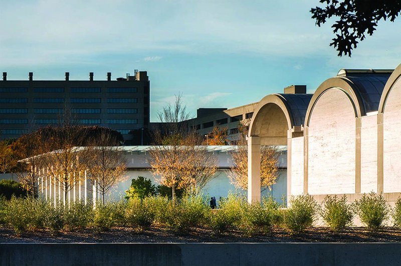 View looking north west past the south face of Kahn’s original museum to the Piano extension.