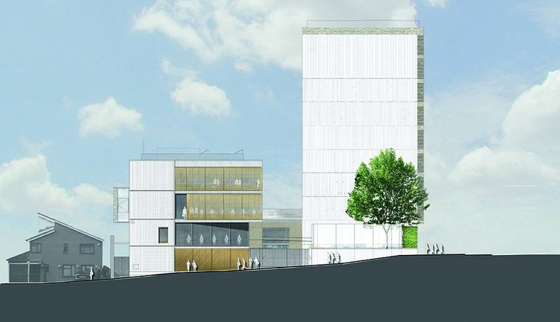 The east elevation of the community centre and flats: the exterior uses industrial materials