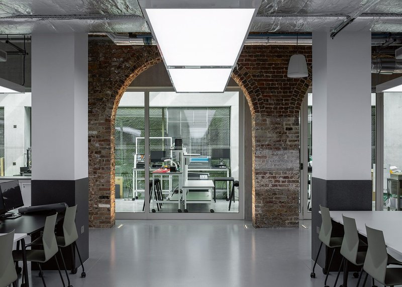 From one teaching space a  layered view takes in newly open  brick arches, maker spaces beyond and the base of the King’s building.