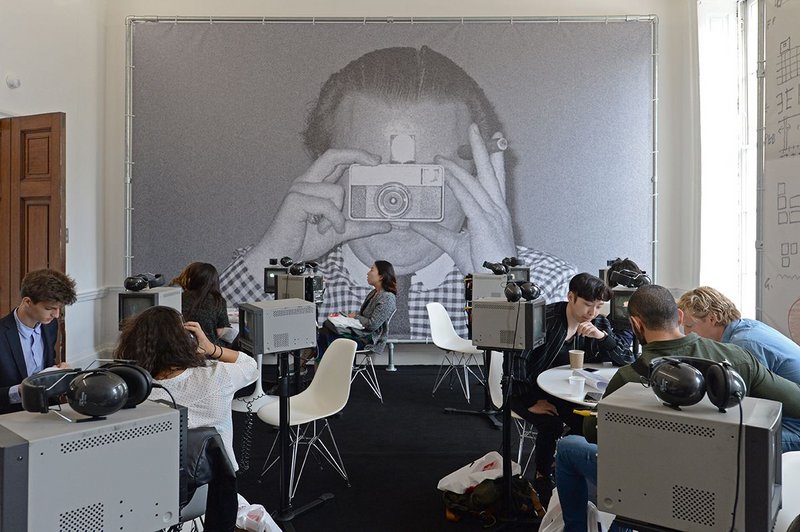 Cedric Price’s image, with customary cigar, looms large over the Memory Bank installation of filmed interviews about Price and his work.