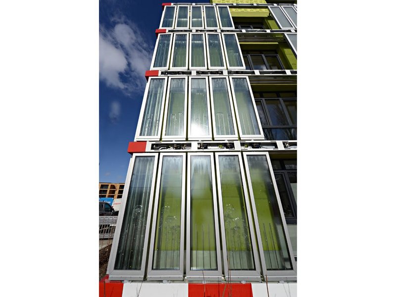 Microalgae cultivated inside the panels is harvested to supply the buildings energy.