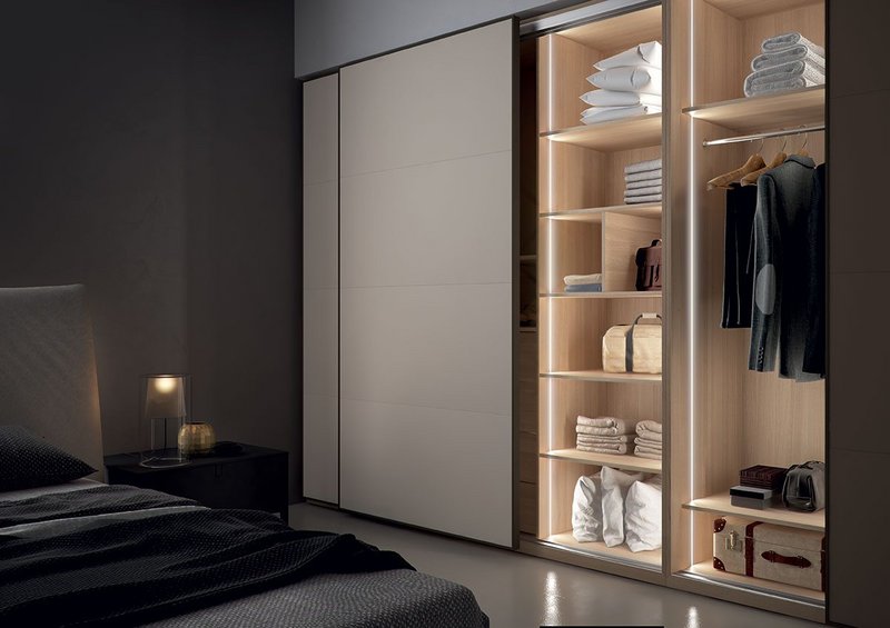 Häfele Slido Power-Chain wardrobe storage with Loox LED flexible plug-in strip lighting.