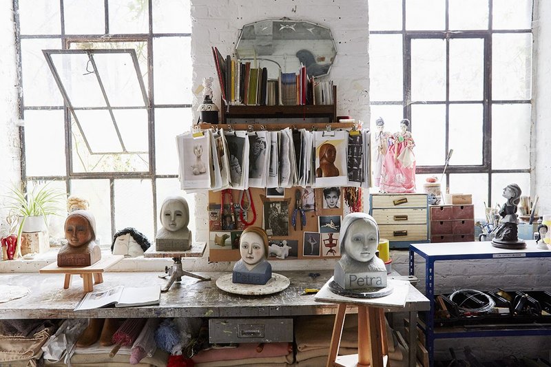 Cathie Pilkington RA’s studio. Busts modelled on the doll for Petra confront the viewer with a forthright stare, from the shelves of Ditchling’s ‘Wunderkammer’.