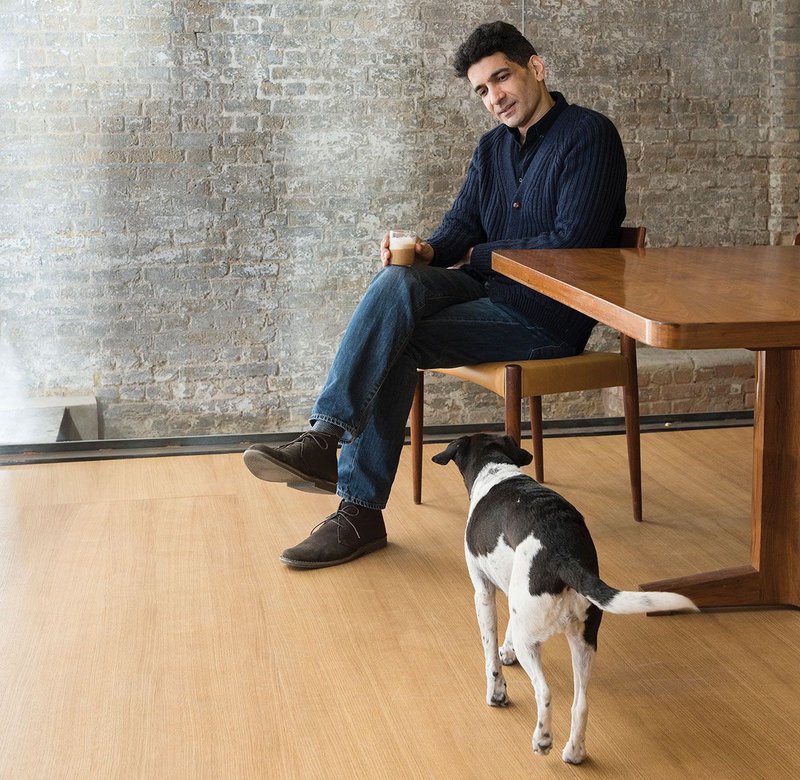 Amin Taha with Moo, the office rescue dog.