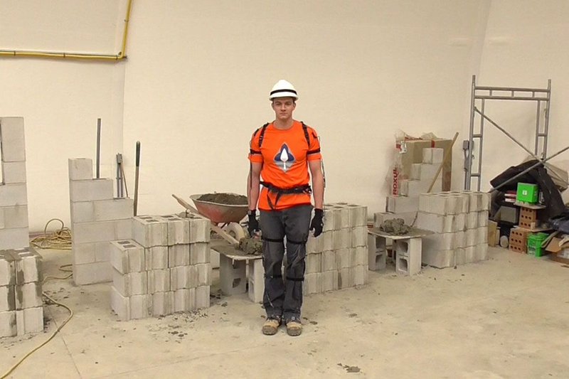 A bricklayer rigged up with the movement sensors.