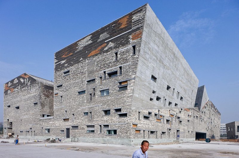 Ningbo Museum, Zhejiang Province, China by Amateur Architecture Studio. The form is inspired by the mountains and ravines of the surrounding area.