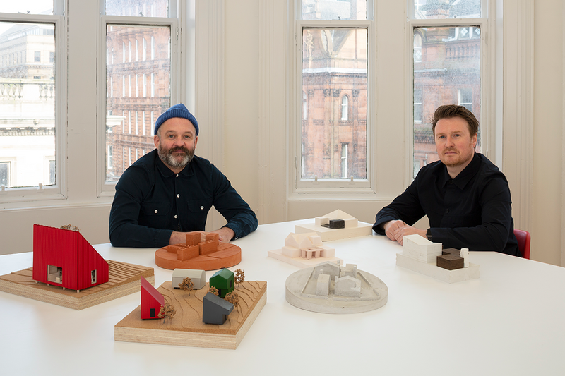 Surrounded by their working models, Mark Bell and Brian McGinlay in their new Baltic Chambers office in the heart of Glasgow.