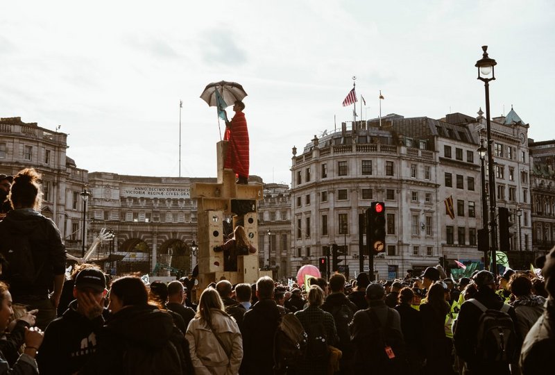 ‘Power to the tower: Protest architecture inspired by 'U-Build' – Studio Bark's Nick Newman stands atop. Boxes were crowdfunded and assembled collectively by participants as part of 'International Rebellion 2' in October 2019.