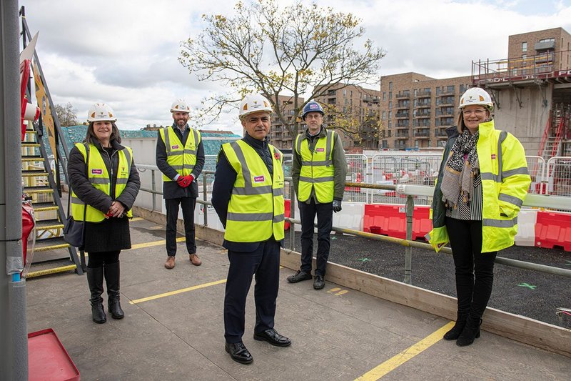 London mayor Sadiq Khan visits a housing scheme in Barking. The new London Plan aims to boost affordable housing for Londoners.