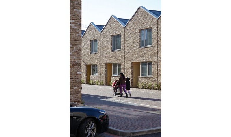 After exuberant work in the town centre this social housing creates modest new streets for Barking.