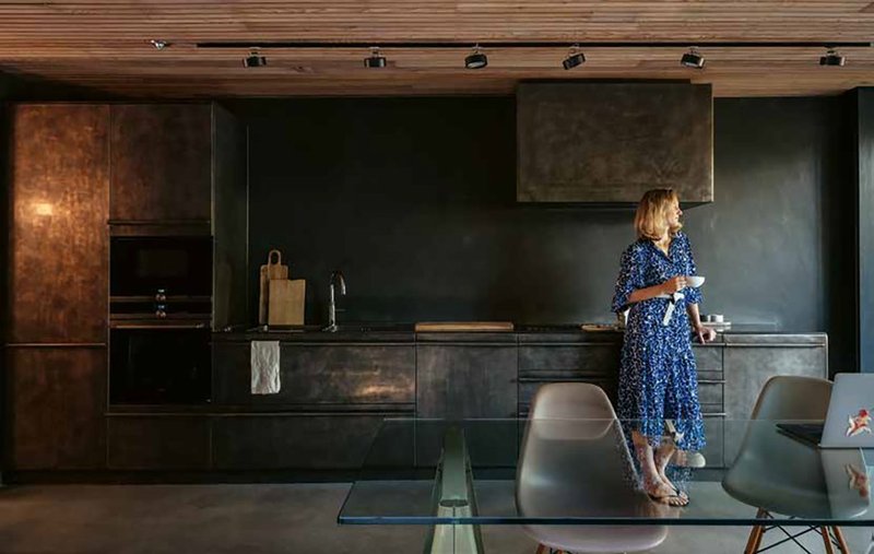 A new timber ceiling helps create a warmer atmosphere in the kitchen.