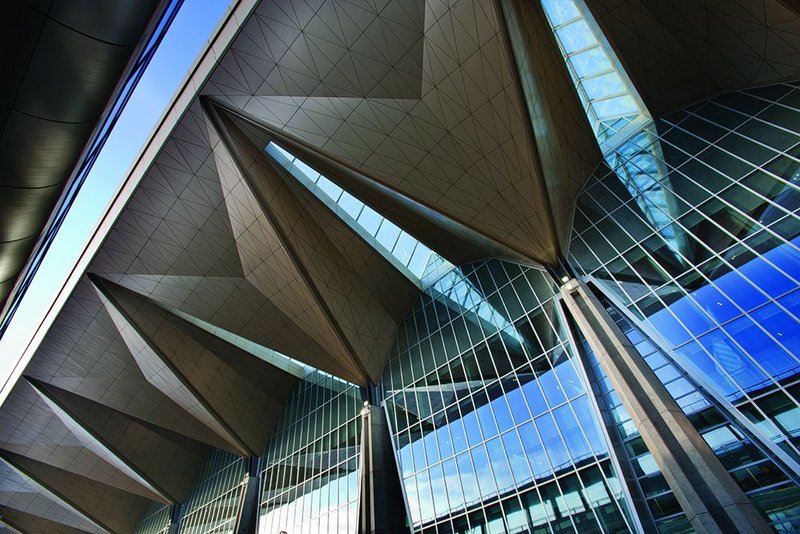 A series of rooflights are expressed as sharp cuts in the  folded-plate roof.