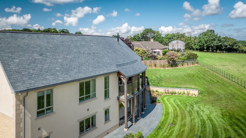 SSQ Riverstone phyllite roof at Compton Place new-build in Stalbridge, Dorset. Riverstone has the same grain, low water absorption and low calcium carbonate content as indigenous slate, but has greater strength and weather resistance.