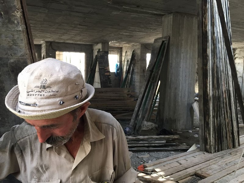 Construction worker on site in Hebron. Lyndon Goode Architects looked at how improvements to health and safety on site could bring economic benefit.