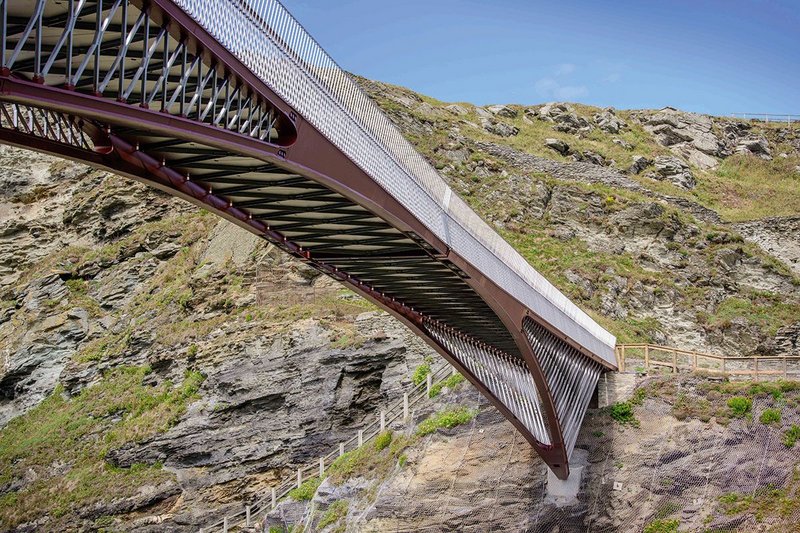 Each of the bridge’s two sections spans 30m, springing off concrete footings on the cliffside.