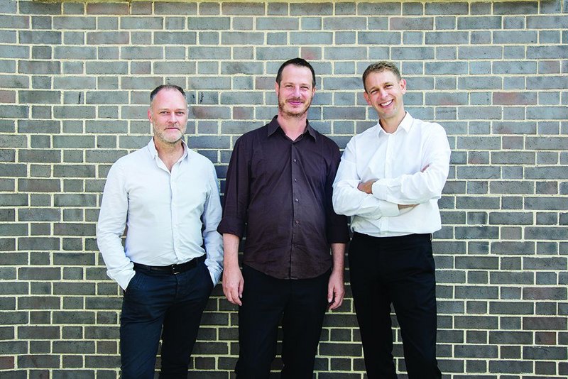 From left: Christopher Watson, William Mann and Stephen Witherford outside their Amnesty International base in East London.