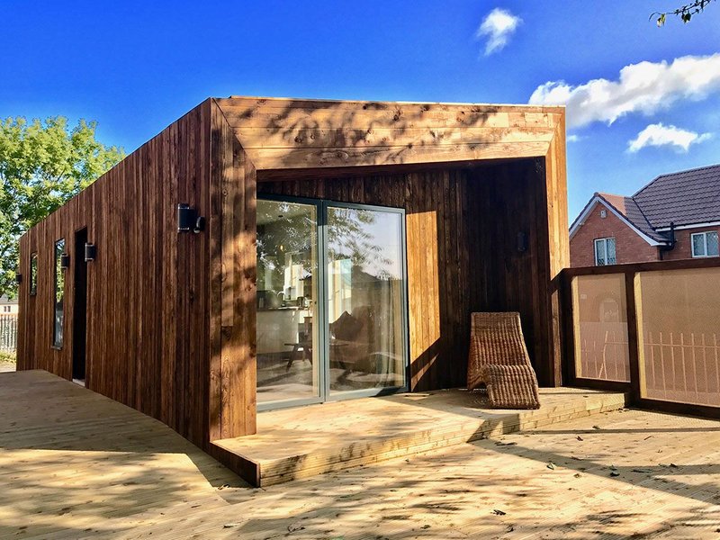 The timber-clad TAM could be parked in the back gardens of Knowle West.