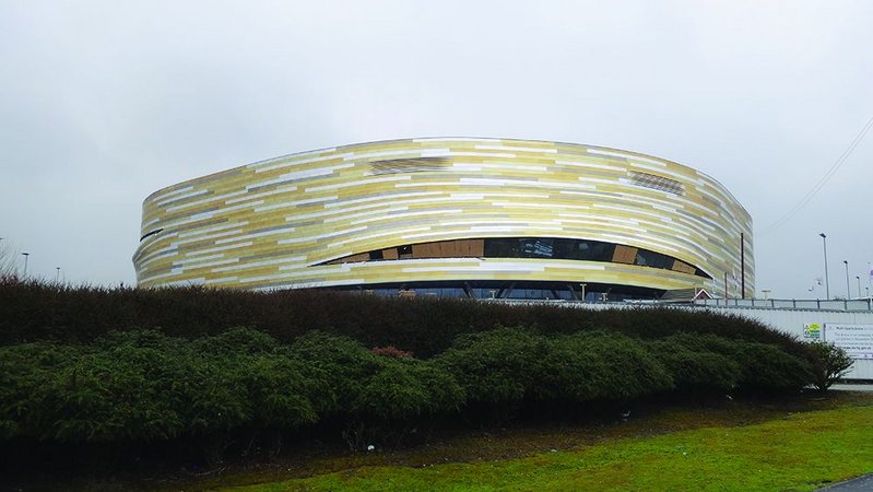 Aluminium shingles cover the exterior of the arena.