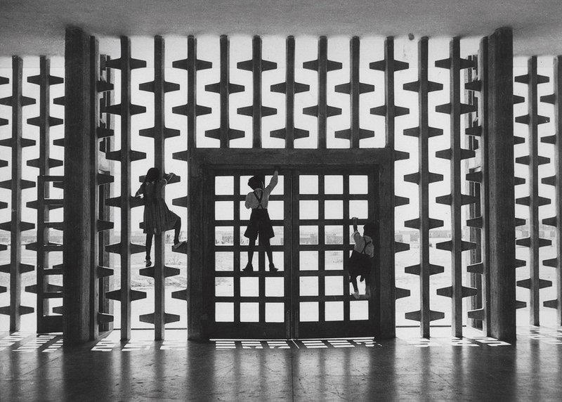 Higher Secondary School, Chandigarh, designed by Jane Drew. With children climbing a concrete sunscreen in 1956.