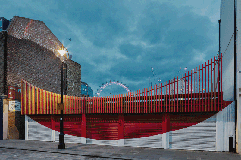 The ‘Lower Marsh Smile’ for Granby Space, Waterloo, London, by IF_DO: the giant smile on the slatted timber screen of the front elevation gives this temporary mixed-use building a distinct identity.