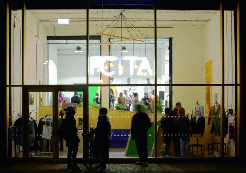 The Tailoring Academy, Tottenham, a training and manufacturing facility created in a converted warehouse by Jan Kattein Architects. A loading bay was transformed into the entrance atrium, giving the academy a prominent public face.