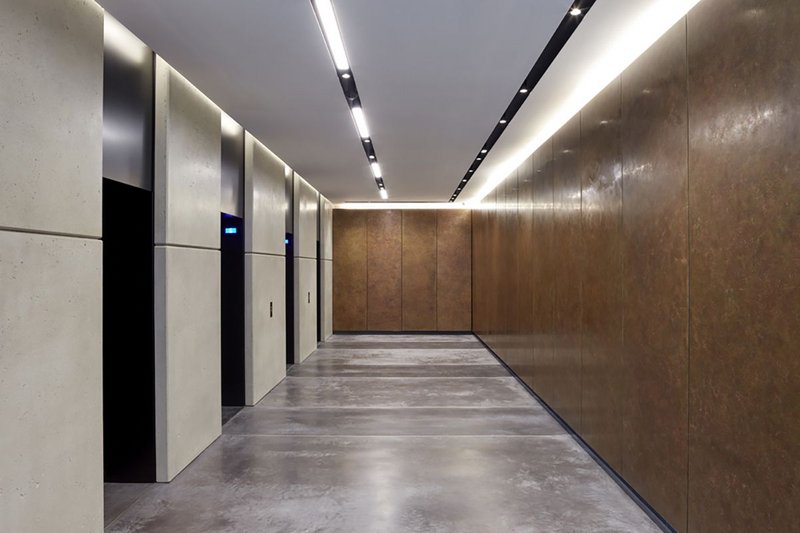 Bennetts Associates has specified Lazenby Mayfair Grey concrete floor with a brass trim for One Bedford Avenue in London.