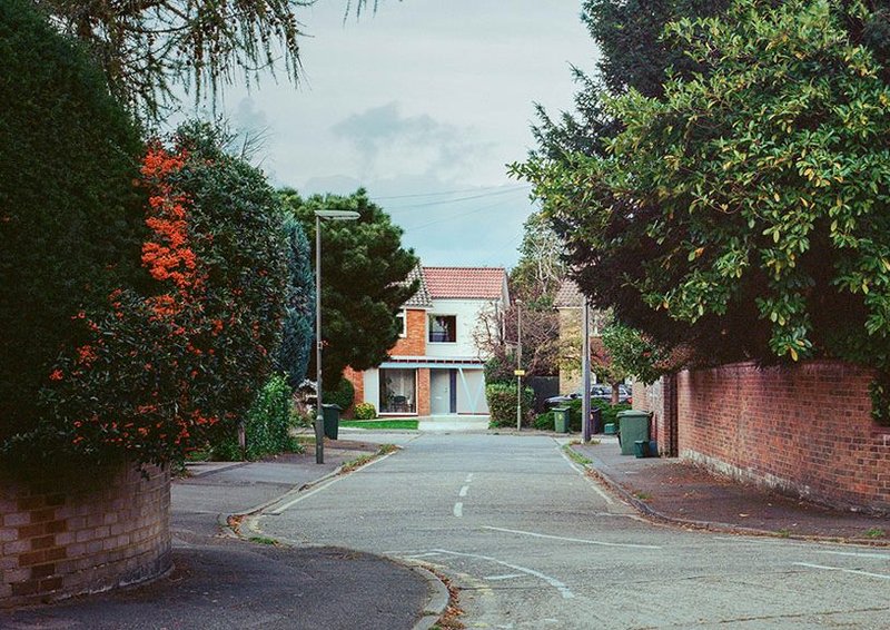 The house sits on a suburban cul-de-sac.