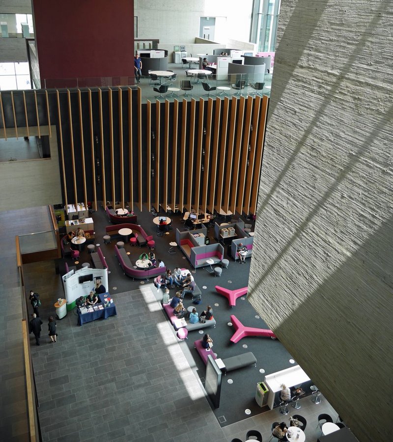 Looking down from the library wing past the hanging lecture theatre to the student forum far below.