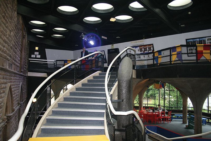 Before image showing the sweeping 1960s stair up to the second floor as well as how the theatre lost its original aesthetic intentions over time.